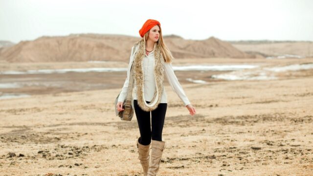Stylish Fashion Model Walking in a Rustic Open Landscape Desktop Wallpaper