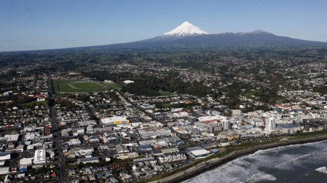 Stunning Aerial View of New Plymouth City with Mount Taranaki 4K Wallpaper