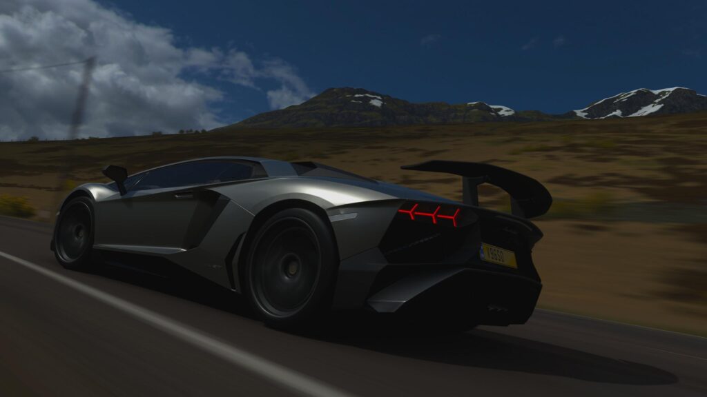 Silver Lamborghini Aventador SVJ Speeding on Mountain Road 4K Wallpaper