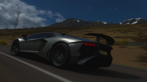 Silver Lamborghini Aventador SVJ Speeding on Mountain Road 4K Wallpaper
