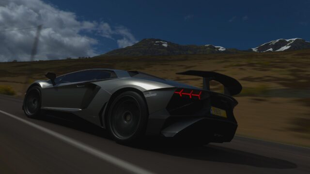 Silver Lamborghini Aventador SVJ Speeding on Mountain Road 4K Wallpaper