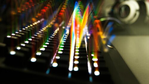 Abstract Colorful Light Trails on Mechanical Keyboard Desktop Wallpaper