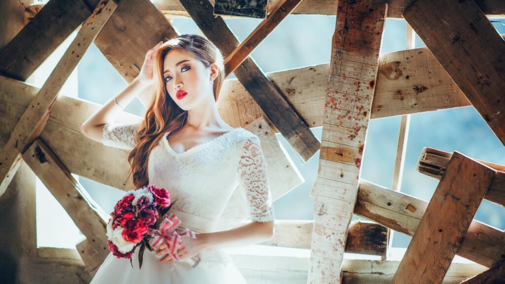 Beautiful Bride with Red Bouquet in Rustic Wooden Architecture Desktop Wallpaper
