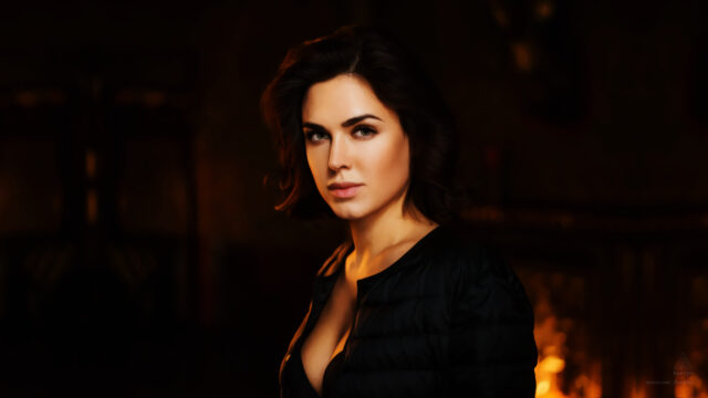 Elegant Brunette Woman with Warm Golden Lighting Portrait Desktop Wallpaper