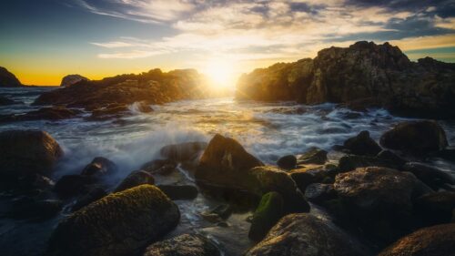 Golden Hour Sunset Over Rocky Coastal Shores 4K Desktop Wallpaper