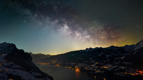 Milky Way Over Snow-Covered Swiss Alps and Alpine Lake 4K Wallpaper