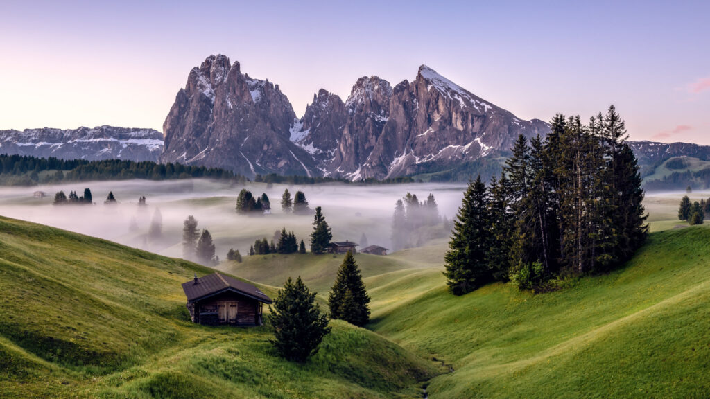 Misty Alpine Landscape with Seiser Alm Meadow and Dramatic Peaks 4K Wallpaper