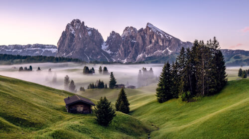 Misty Alpine Landscape with Seiser Alm Meadow and Dramatic Peaks 4K Wallpaper