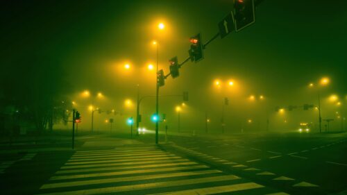 Eerie Foggy Night City Intersection 4K Wallpaper