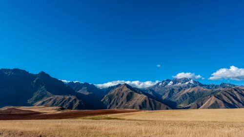 Stunning Andes Mountain Range with Golden Wheat Fields 4K Desktop Wallpaper