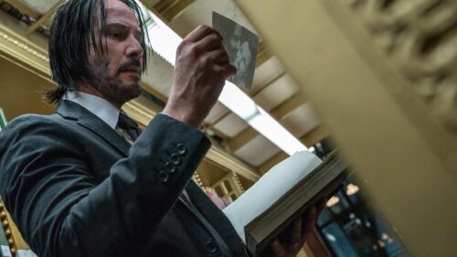 Keanu Reeves as John Wick Reading in Library Desktop Wallpaper 4K
