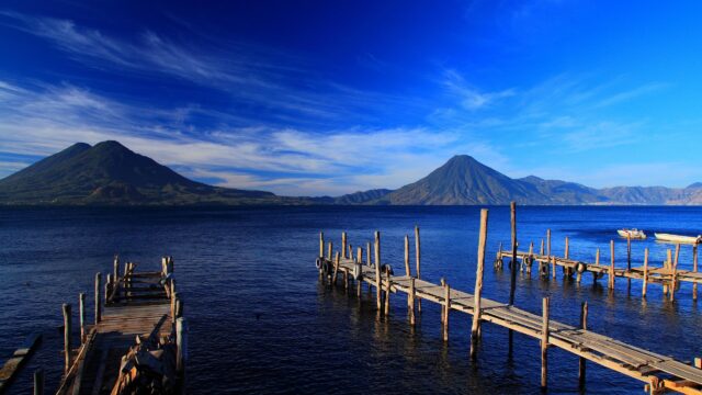 Serene Lake Atitlan Wooden Docks and Volcanic Landscape 4K Desktop Wallpaper