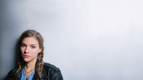 Young Woman in Leather Jacket Portrait 4K Desktop Wallpaper