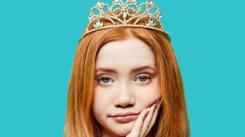 Beautiful Redhead Girl Wearing a Tiara on Teal Background 4K Wallpaper