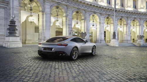 Stunning Silver Ferrari Roma Parked on Historic Cobblestone Street 4K Desktop Wallpaper