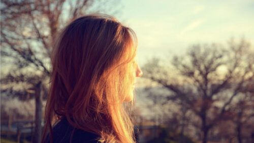 Dreamy Profile of a Woman in Golden Hour Sunlight Desktop Wallpaper