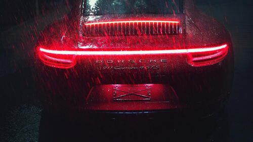 Stunning Red Porsche 911 Carrera 4 GTS in the Rain Desktop Wallpaper