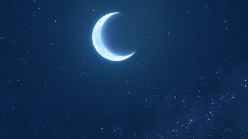 Minimalist Crescent Moon Shining in a Deep Blue Starry Night Sky Desktop Wallpaper