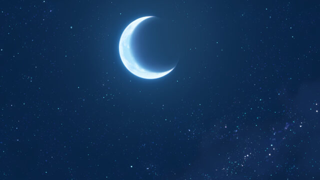 Minimalist Crescent Moon Shining in a Deep Blue Starry Night Sky Desktop Wallpaper