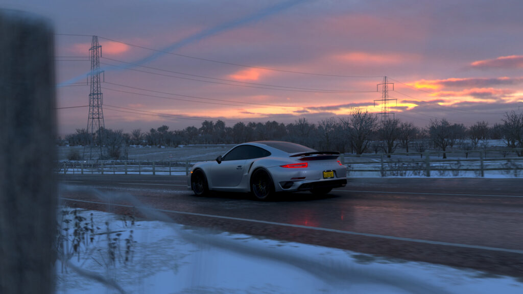 Stunning Porsche 911 Turbo S Driving on Snowy Road at Sunset 4K Wallpaper