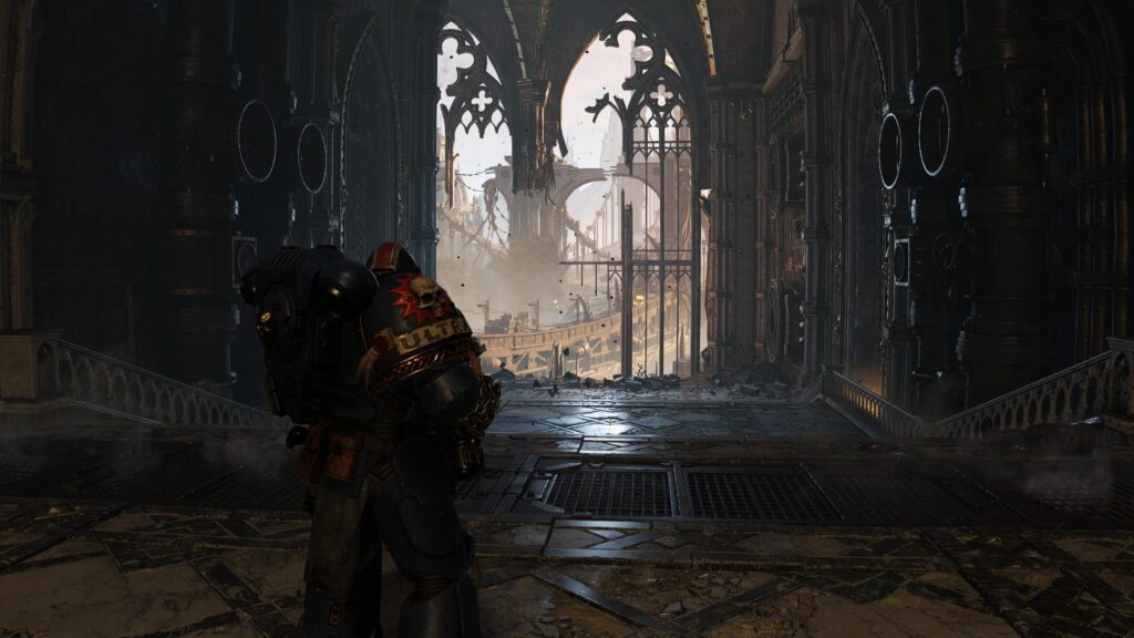 Space Marine Ultramarine Standing in Ruined Gothic Cathedral 4K Desktop Wallpaper