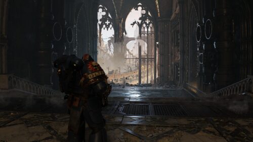 Space Marine Ultramarine Standing in Ruined Gothic Cathedral 4K Desktop Wallpaper