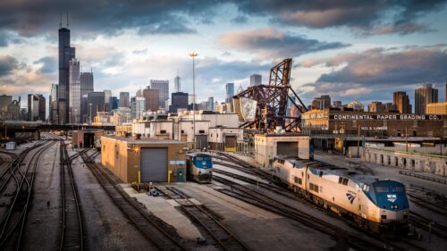 Chicago Skyline and Amtrak Train Yard at Sunset Desktop Wallpaper