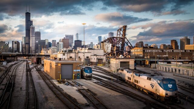 Chicago Skyline and Amtrak Train Yard at Sunset Desktop Wallpaper