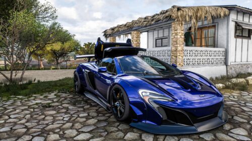 Blue McLaren 650S Sports Car Parked by a Tropical Beach House Desktop Wallpaper