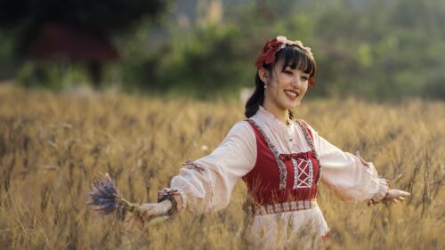 Beautiful Girl in Lolita Fashion Standing in a Golden Wheat Field 4K Wallpaper