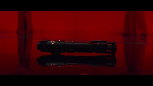 Kylo Ren Lightsaber Resting on Reflective Surface 4K Desktop Wallpaper