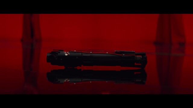 Kylo Ren Lightsaber Resting on Reflective Surface 4K Desktop Wallpaper