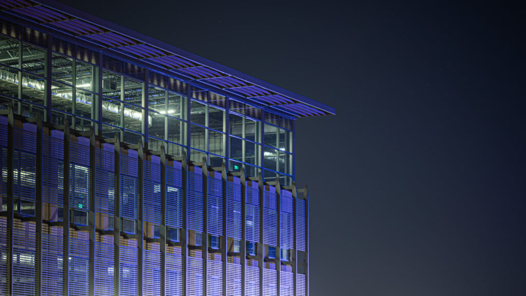 Modern Architectural Skyscraper Facade at Night 4K Desktop Wallpaper