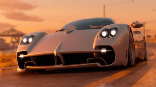 Stunning Pagani Huayra R Driving on Coastal Road at Sunset Desktop Wallpaper