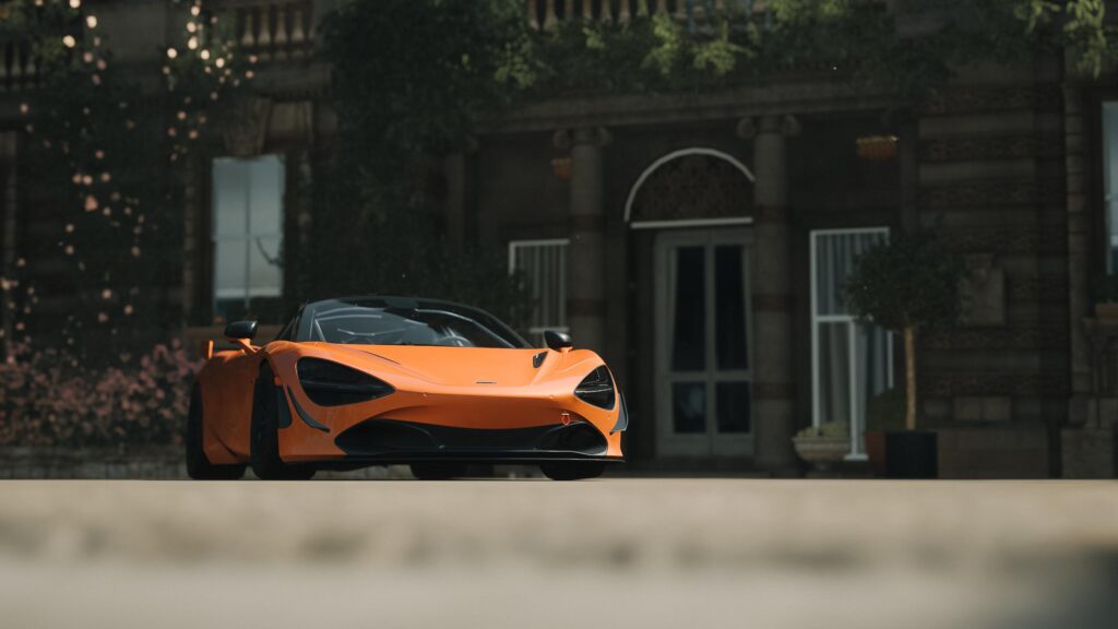 McLaren 720S Orange Supercar Parked at Historic Estate PC Wallpaper