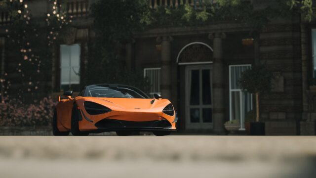 McLaren 720S Orange Supercar Parked at Historic Estate PC Wallpaper