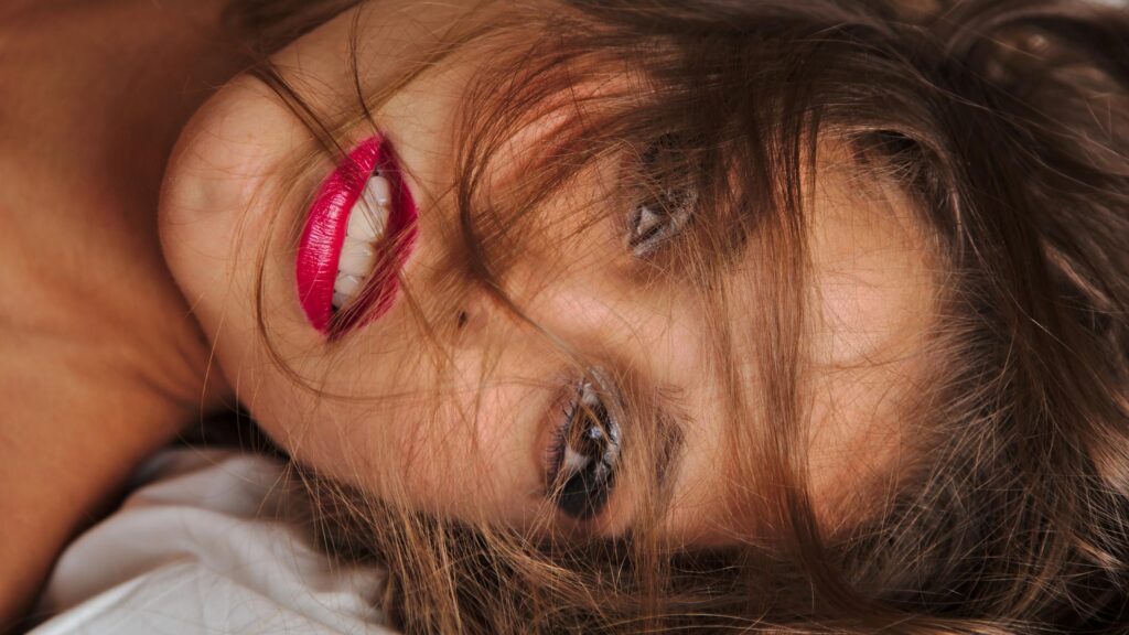 Stunning Close Up Portrait of a Woman with Vibrant Red Lips Desktop Wallpaper