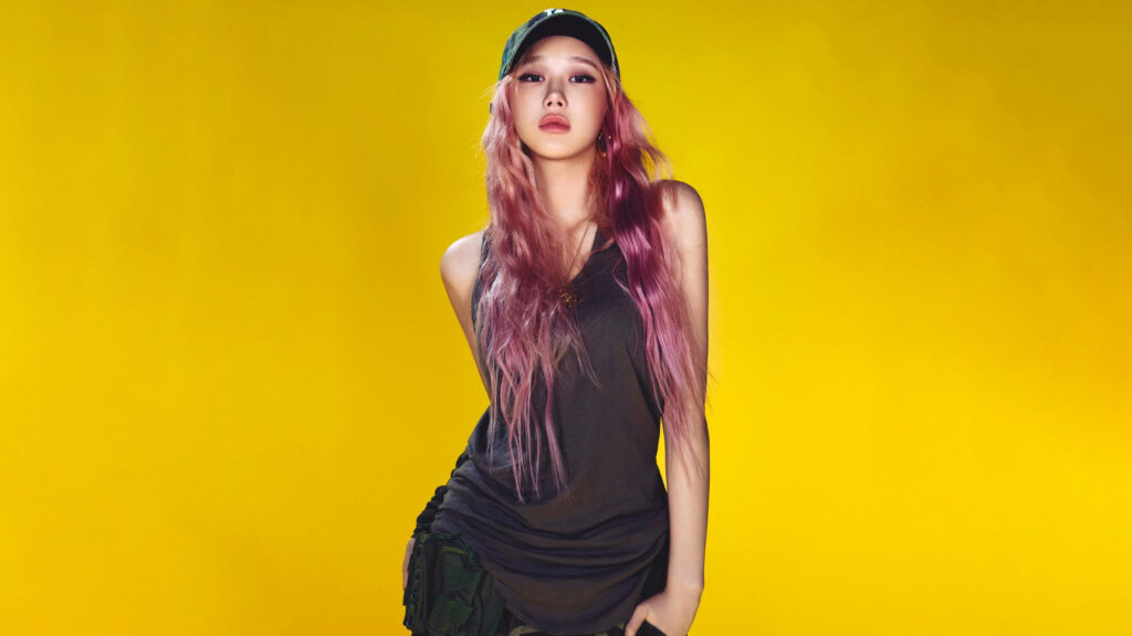 Stylish K-Pop Idol with Pink Hair on Vibrant Yellow Background 4K Wallpaper