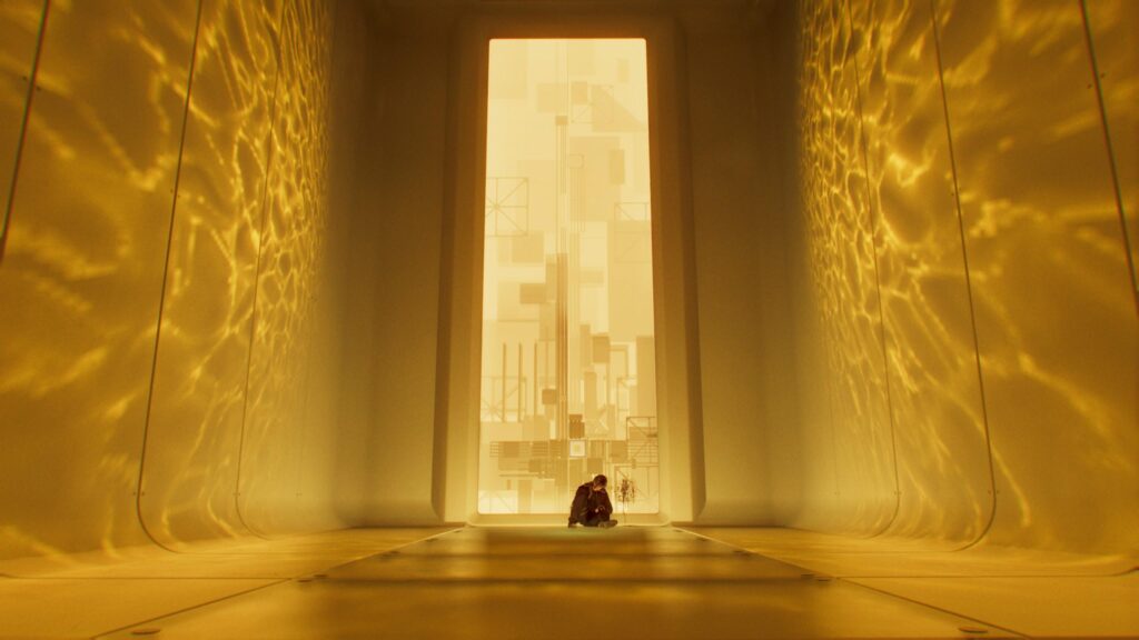 Solitary Figure in Abstract Futuristic Golden Corridor 4K Wallpaper