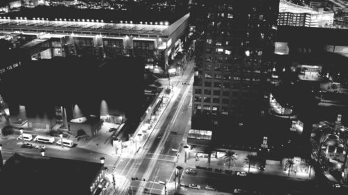 Stunning Aerial Night View of Modern City Street and Skyscrapers 4K Wallpaper
