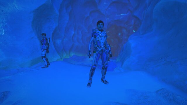 Futuristic Space Explorer in Blue Ice Cave 4K Desktop Wallpaper