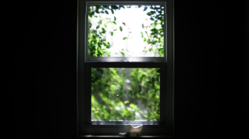Minimalist View Through Window with Decorative Shoe Ornament 4K Wallpaper