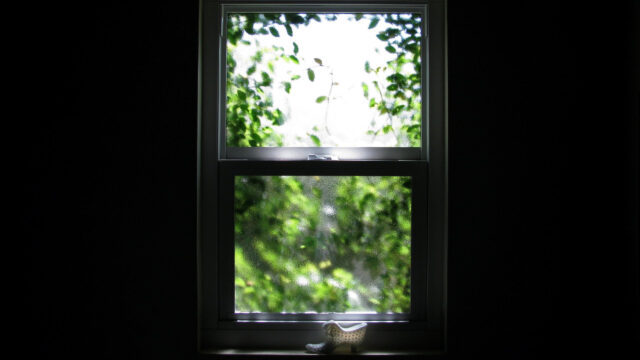 Minimalist View Through Window with Decorative Shoe Ornament 4K Wallpaper