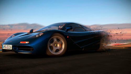 Blue McLaren F1 Drifting on Asphalt at Sunset 4K Wallpaper