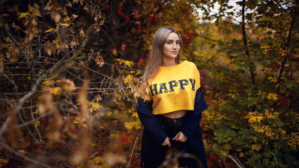 Beautiful Young Woman in Yellow Crop Top Posing in Autumn Forest Desktop Wallpaper
