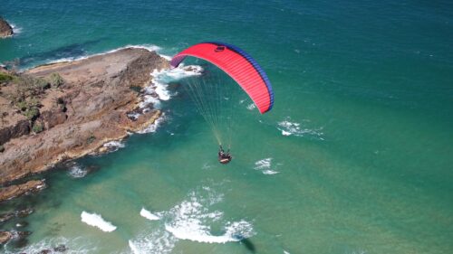 Paraglider Soaring Over Tropical Coastal Waters 4K Desktop Wallpaper