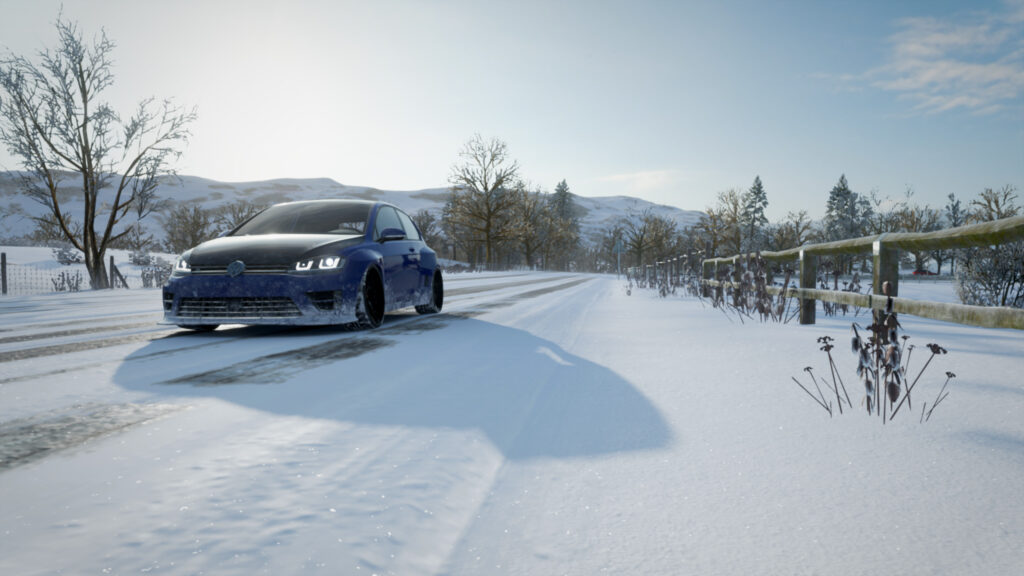 Blue Volkswagen Golf R Driving Through Snowy Landscape PC Wallpaper