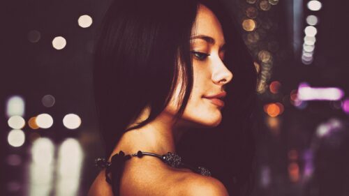 Stunning Woman Portrait with City Lights Bokeh Effect 4K Desktop Wallpaper