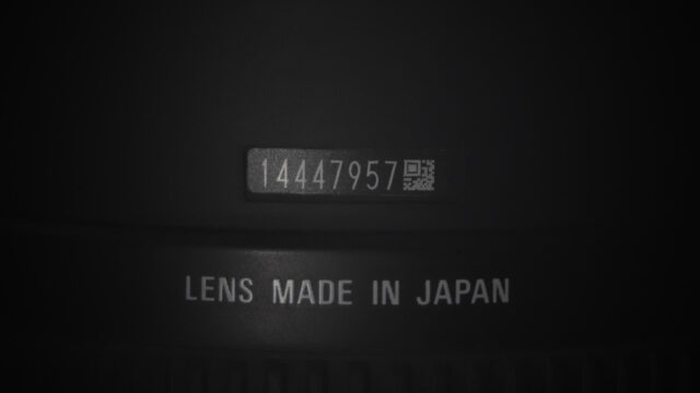 Macro Close Up of Camera Lens Serial Number and Japan Manufacturing Mark 4K Wallpaper