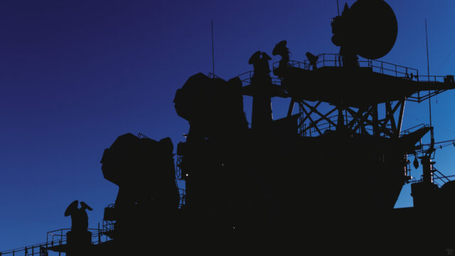 Silhouette of Warship Radar Towers at Sunset 4K Desktop Wallpaper